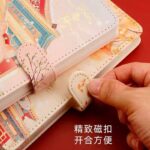 دفتر جلد پفکی JINGU طرح گربه نارنجی کد 6811 - Image 4